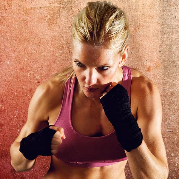 Mixed Martial Arts Lessons for Adults in Springfield VA - Lady Kickboxing Focused Background