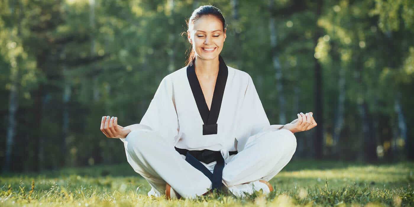 Martial Arts Lessons for Adults in Springfield VA - Happy Woman Meditated Sitting Background